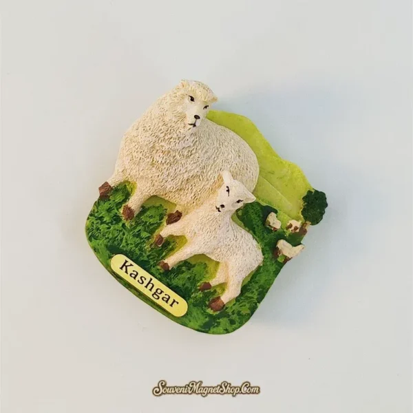 Angled view of the Kashgar sheep and lamb fridge magnet showing the raised animals, hillside and background flock.