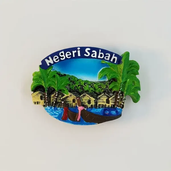 Sabah water village fridge magnet with palm trees, stilt houses, boats and raised Negeri Sabah lettering.