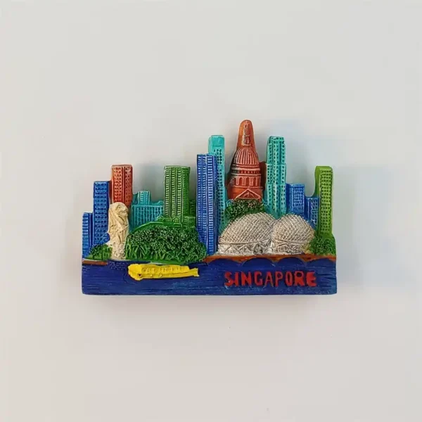 Singapore skyline fridge magnet with the Merlion, twin Esplanade domes, colorful towers and a yellow boat on a blue waterfront.