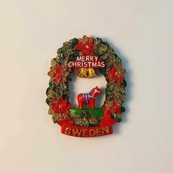 Sweden Dala horse Christmas wreath fridge magnet with red flowers, gold bells and Merry Christmas lettering.