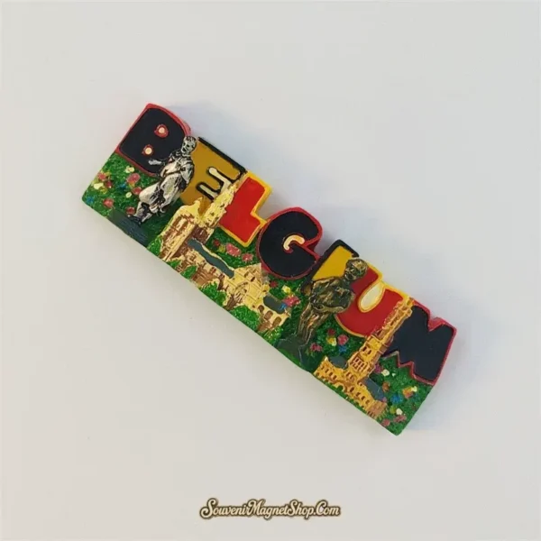 Belgium landmark letters fridge magnet tilted clockwise, showing raised golden towers, a silver-toned figure and Manneken Pis.