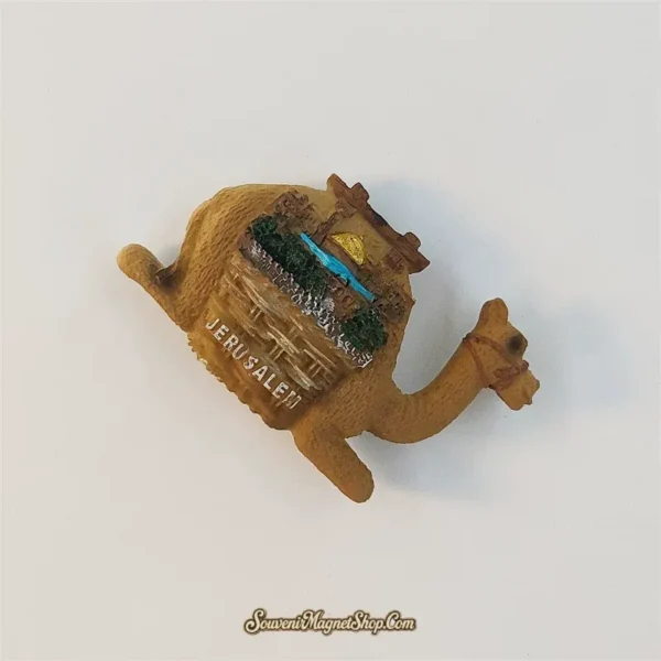 Angled Jerusalem camel fridge magnet showing the textured sand-brown body and layered golden-dome cityscape.