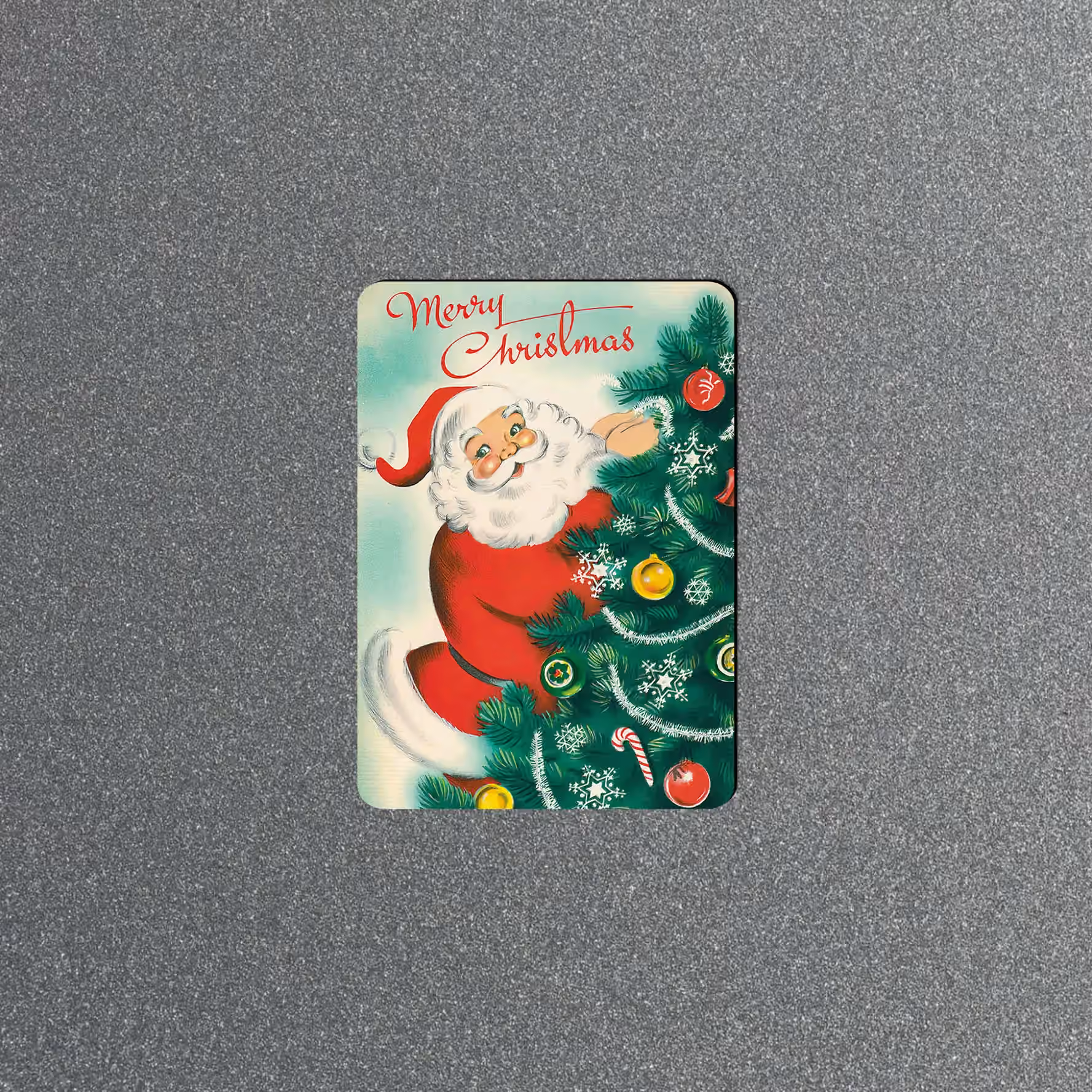 Vintage Merry Christmas magnet showing Santa beside a decorated green tree with colorful ornaments.