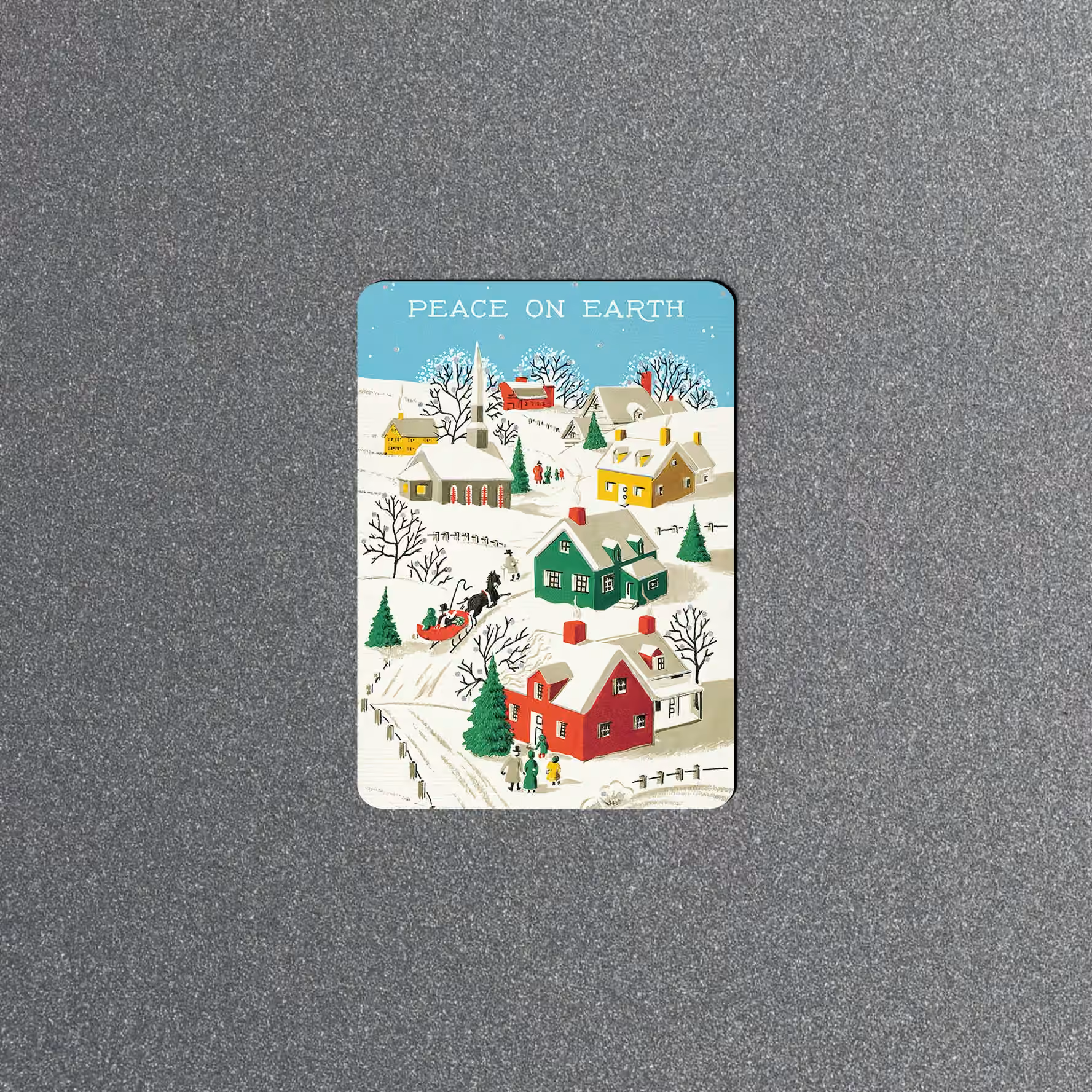 Peace on Earth Christmas magnet with a snowy village, colorful houses, trees, and a horse-drawn sleigh.