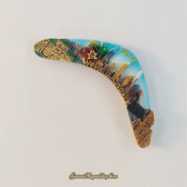 Perth skyline boomerang fridge magnet tilted clockwise, showing raised buildings and Western Australia lettering along the inner curve.