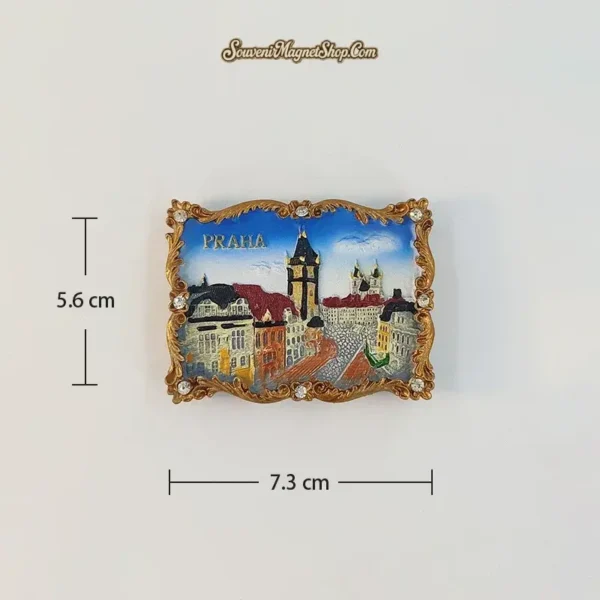 Wenceslas Square A variant fridge magnet with a tall dark-roofed tower, red-roofed buildings and a paved square; 7.3 cm wide and 5.6 cm high.