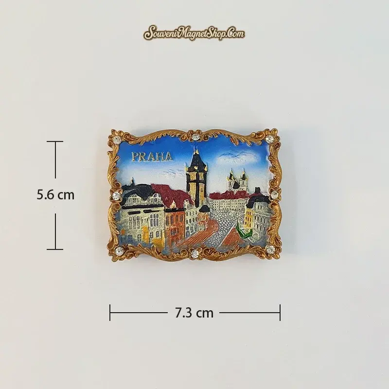 Wenceslas Square A variant fridge magnet with a tall dark-roofed tower, red-roofed buildings and a paved square; 7.3 cm wide and 5.6 cm high.
