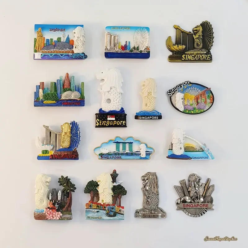Singapore souvenir fridge magnets featuring Merlion figures, Marina Bay Sands and the Singapore Flyer, arranged on a light background.