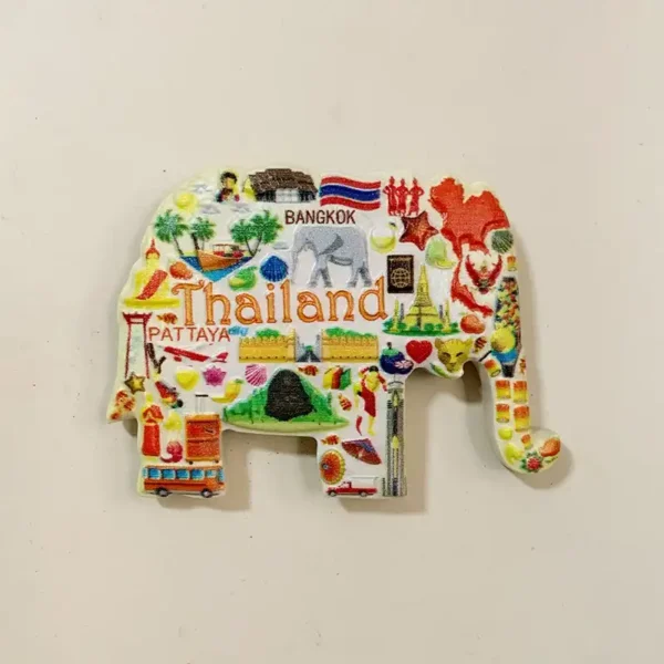 Front view of a Thailand elephant-shaped fridge magnet with Bangkok and Pattaya lettering, a Thai flag and colorful travel icons.