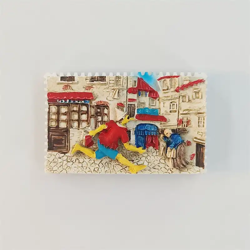 Pinocchio village street fridge magnet with a running puppet in a red shirt and blue shorts, cream buildings and red awnings, front view